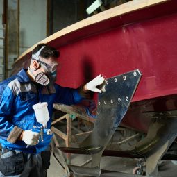 man-painting-boats-in-yacht-workshop.jpg